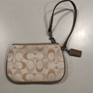 Coach wristlet/coin purse in tan/cream